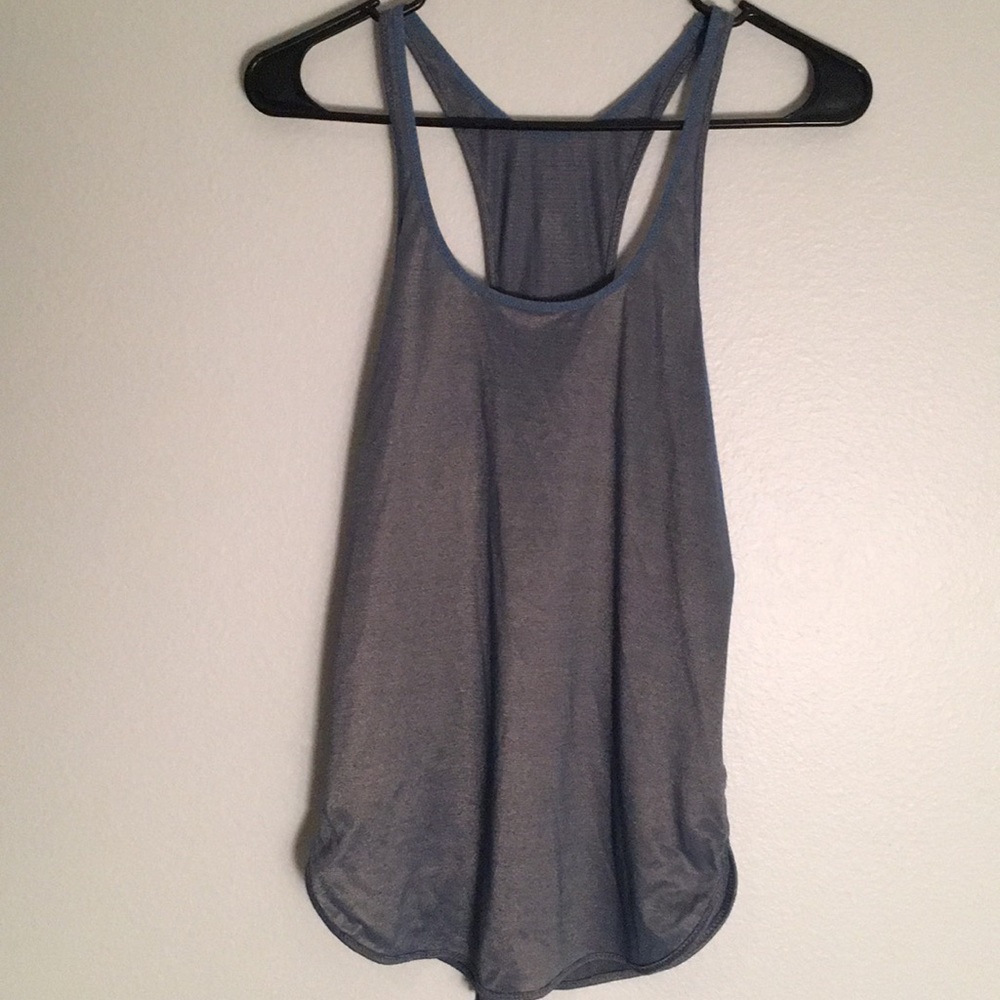 Woman’s blue and gold shimmery top